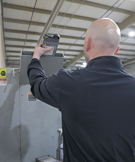 DataShield employee putting a hard drive through a shredder