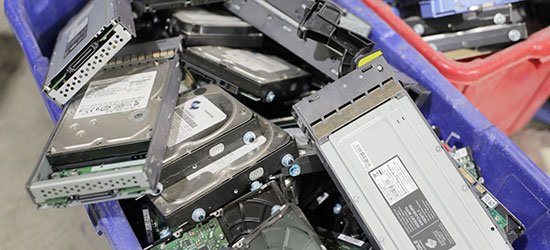 a bin of hard drives ready for destruction