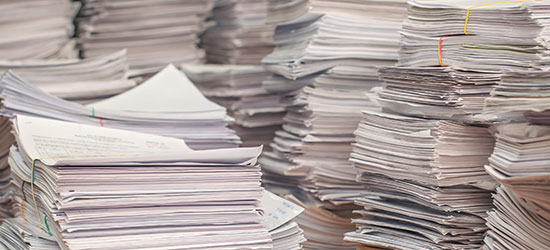 stacks of documents ready for shredding